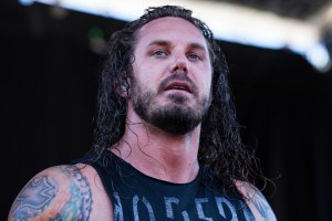as-i-lay-dying-frontman-tim-lambesis-seen-on-video-hitting-and-kicking-his-dog-ex-wife-dany-responds